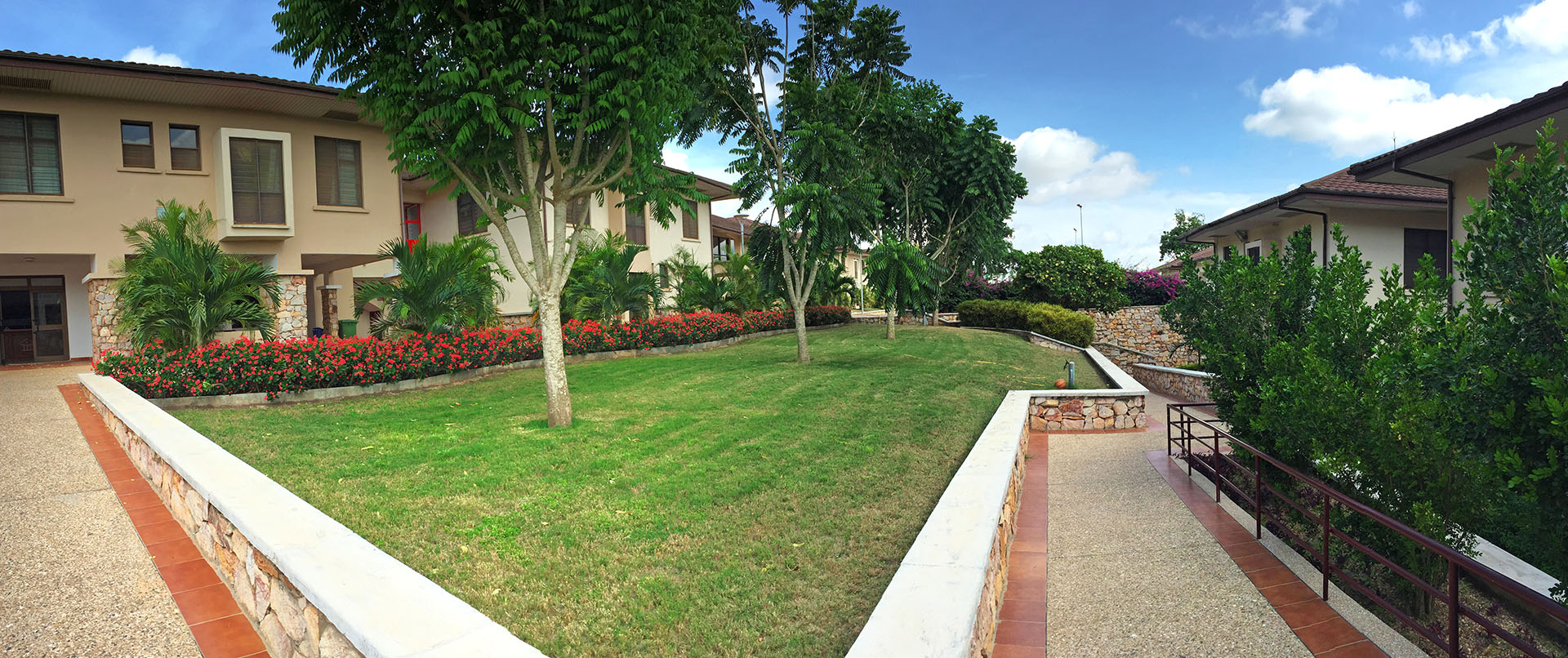 Main courtyard in Ashesi's student courtyard, with Sutherland Hall in the background